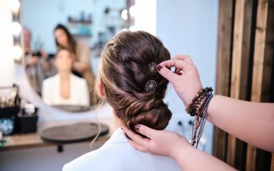 hairdresser-finishing-the-hairstyle-of-a-bride-in-the-hair-salon-.jpg